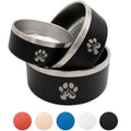 Two black pet bowls with silver rims and paw prints on a white background, with color swatches below.