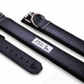 Black dog collar with a visible brand label on a white background