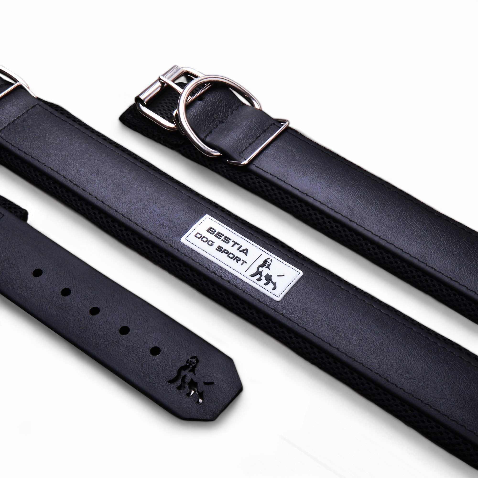 Black dog collar with a visible brand label on a white background