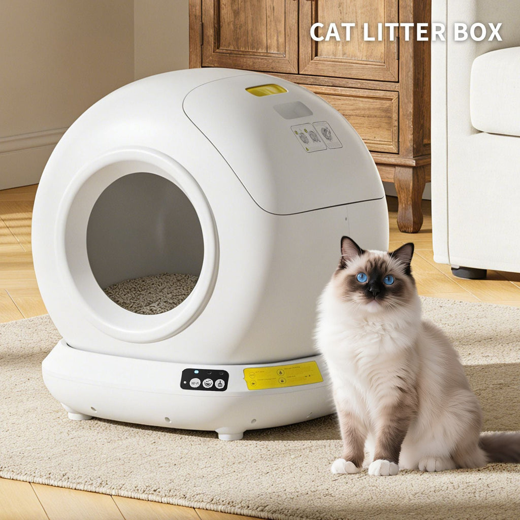 White self-cleaning cat litter box with a cat sitting next to it on a carpeted floor.